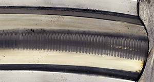 Figure 3: In a process called fluting, pits form washboard-like ridges on a bearing race wall—ridges that cause still more noise and vibration and accelerate bearing failure. Courtesy: Electro Static Technology