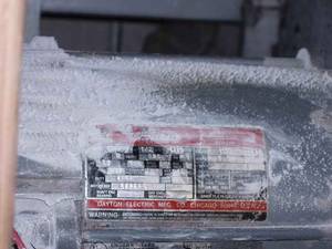 Figure 4: This shows a motor installed in an unusually dusty industrial environment. This is an extreme example of a lack of maintenance which could affect the life expectancy of the motor and associated drives. Courtesy: McGuire Engineers