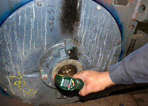 Using a digital infrared thermometer to check motor bearing temperature can help monitor winding temperature. Courtesy: EASA